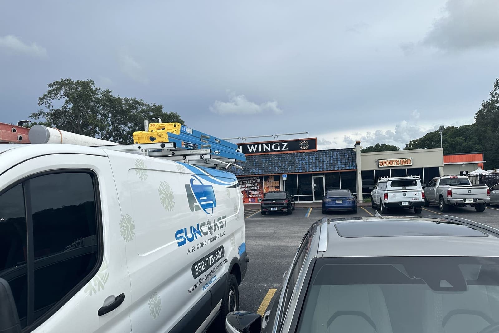 A close view of the SunCoast van outside a shopping plaza in Hudson, FL.