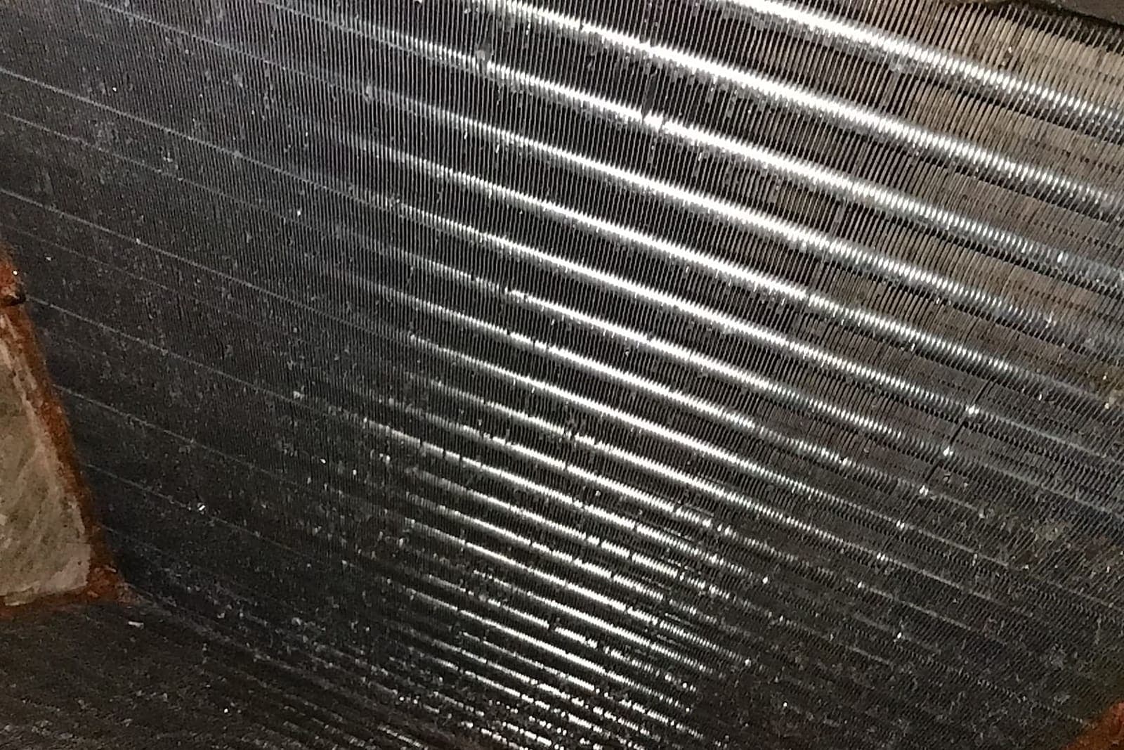 An evaporator coil with its fins clogged.
