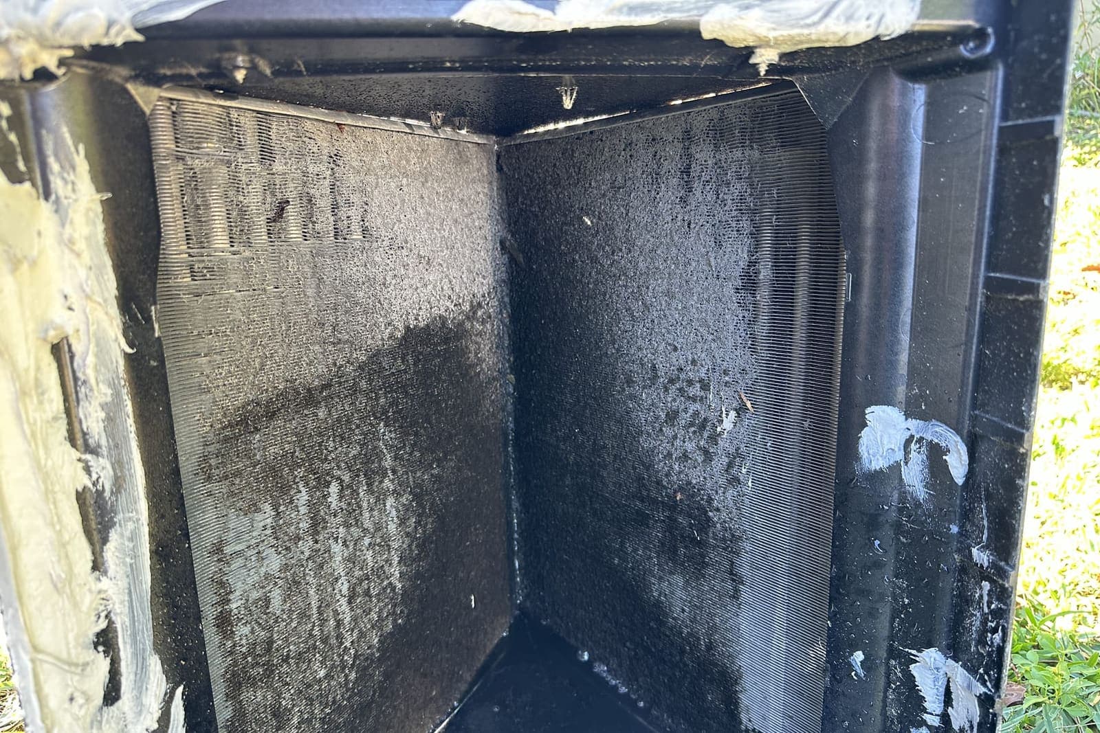 The inside of a dirty sheet-metal plenum in Spring Hill, FL.