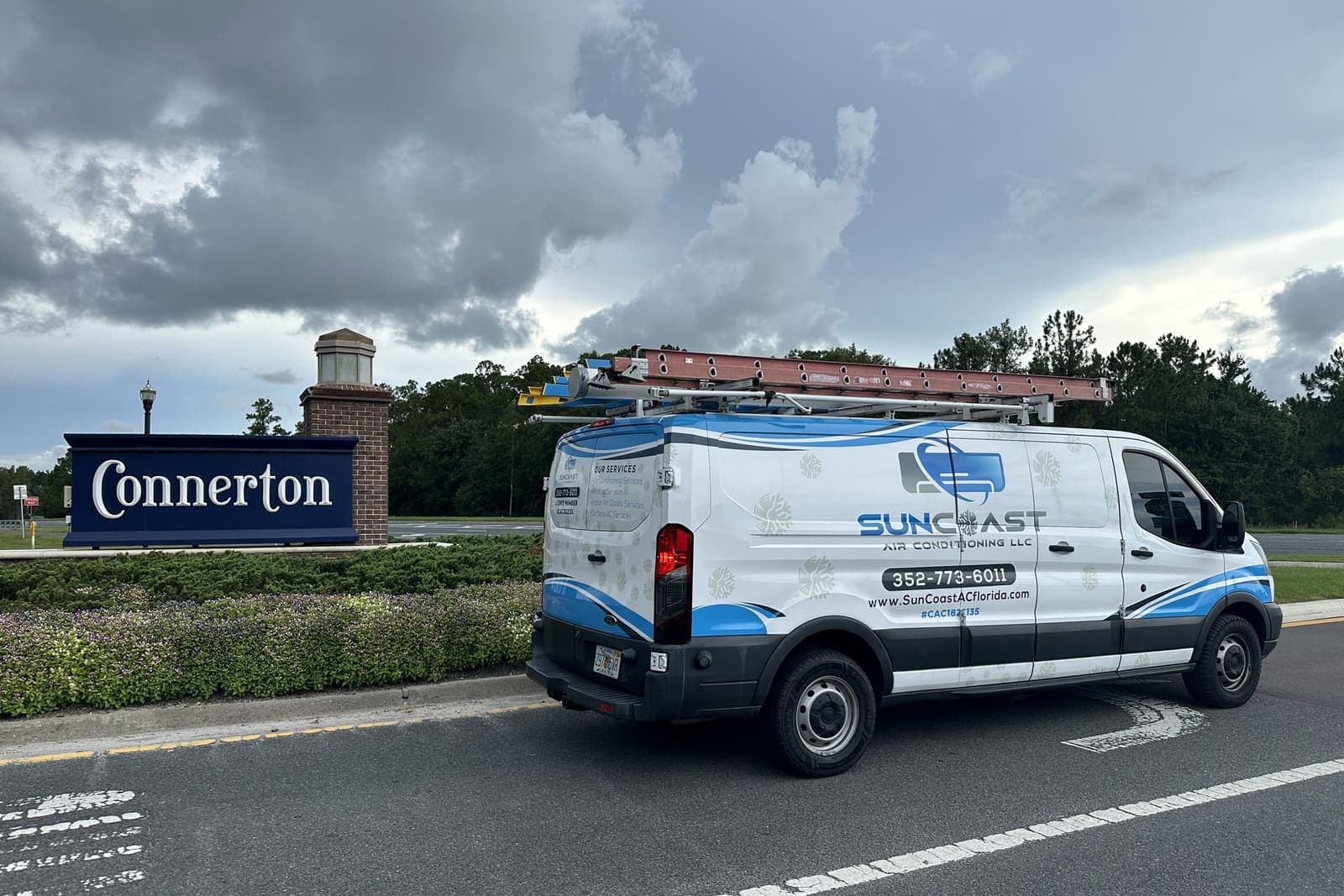 The SunCoast van parked beside the Connerton community sign in Land O' Lakes, FL.