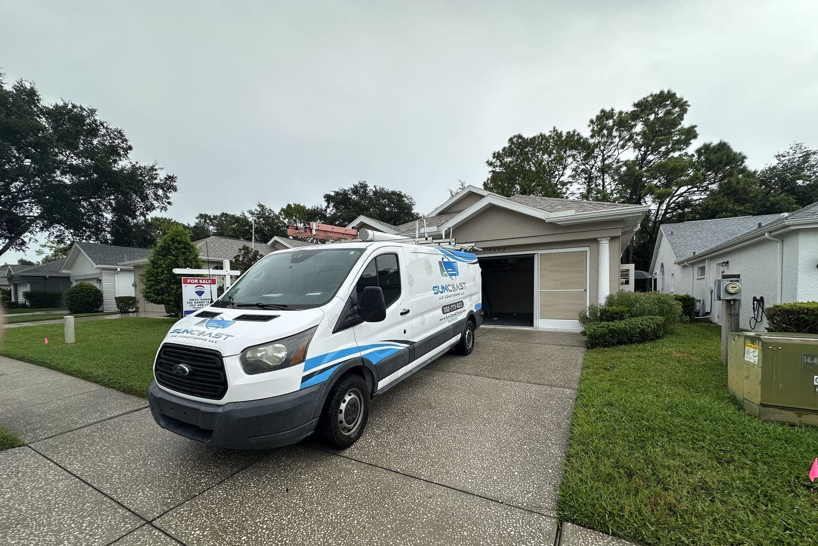 The SunCoast van parked in a driveway outside a garage in Hernando County, FL.