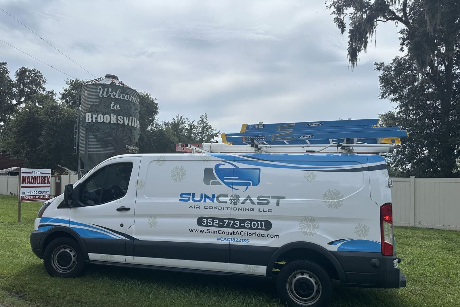 The SunCoast van parked beside a Welcome to Brooksville sign in Brooksville, FL.