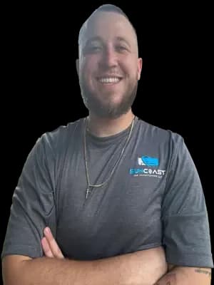 JJ, AC technician at SunCoast Air Conditioning LLC, in a SunCoast uniform shirt