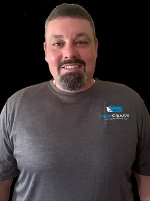 Philip, AC technician at SunCoast Air Conditioning LLC, in a SunCoast uniform shirt