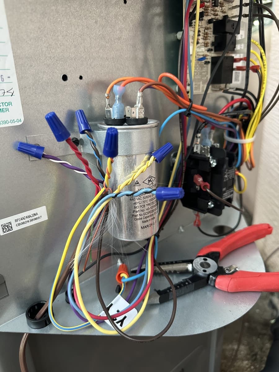 A capacitor and contactor wiring in an outdoor condenser panel in Spring Hill, FL.