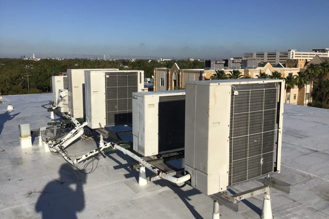 A cluster of outdoor units on a flat roof.