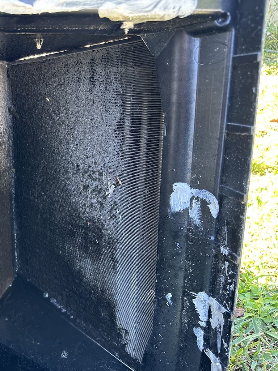 The inside of a dirty sheet-metal plenum in Spring Hill, FL.