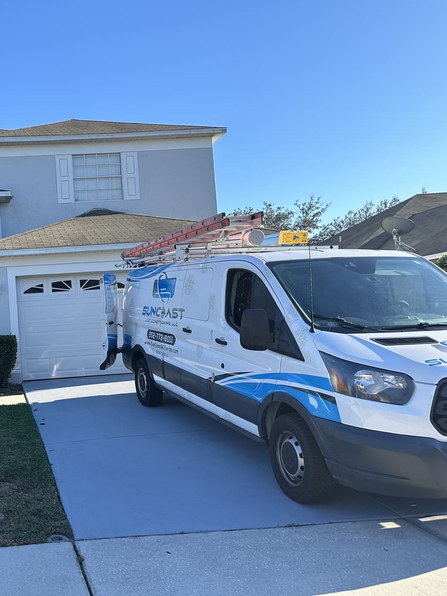 The SunCoast van parked in front of a two-story home in Spring Hill, FL.