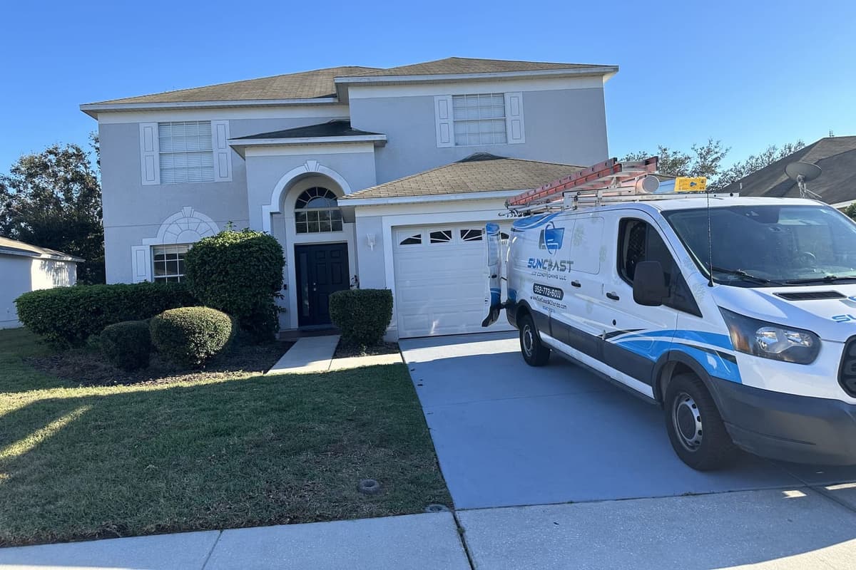 The SunCoast van parked in front of a two-story home in Spring Hill, FL.