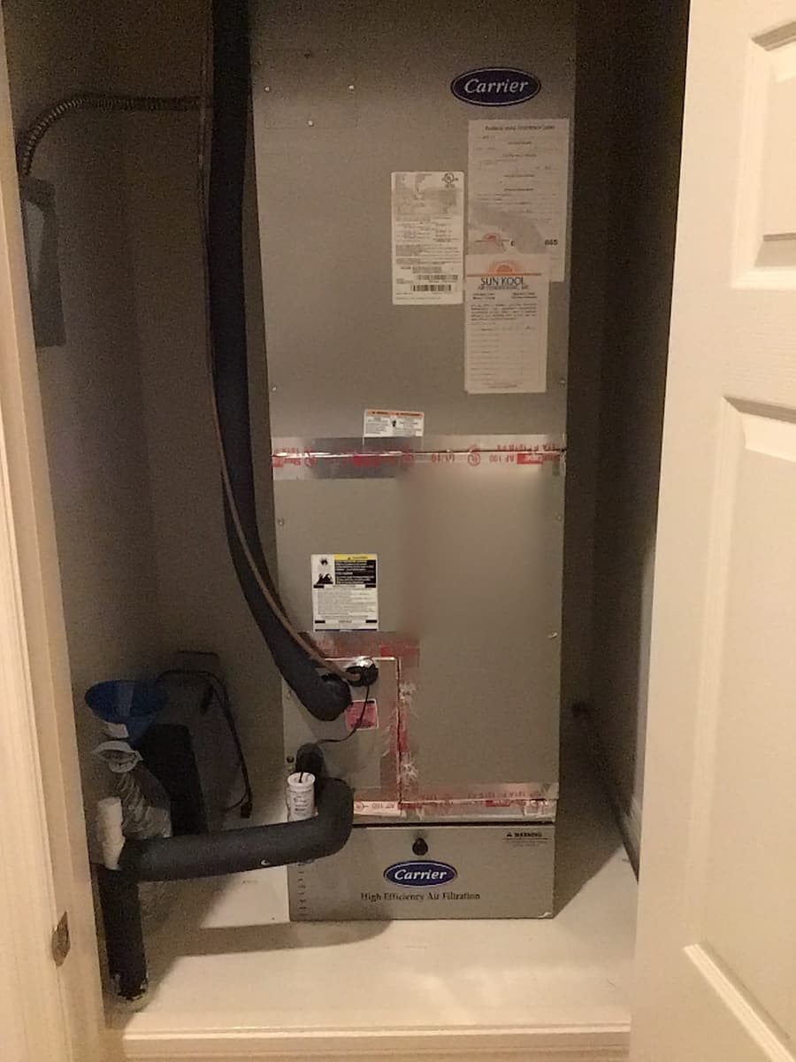 An air handler with a freshly sealed duct connection.