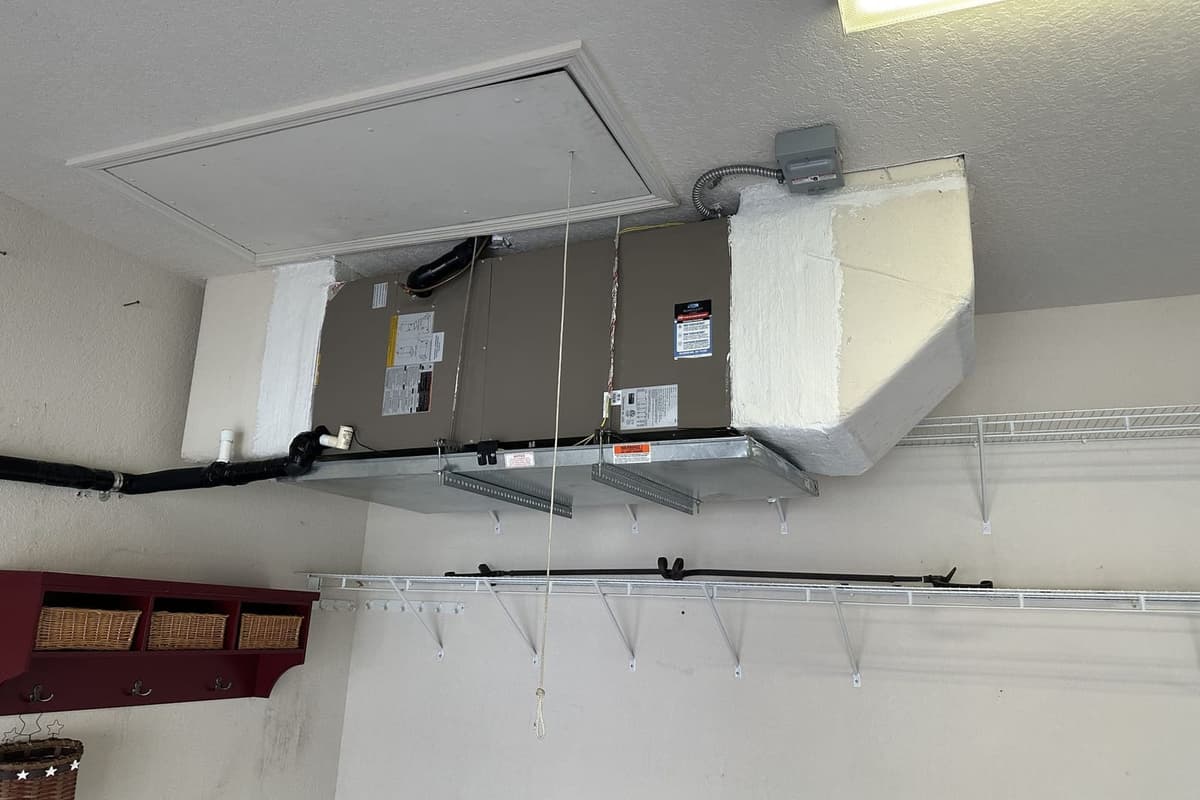 An air handler hung from the ceiling in a garage in Hernando County, FL.