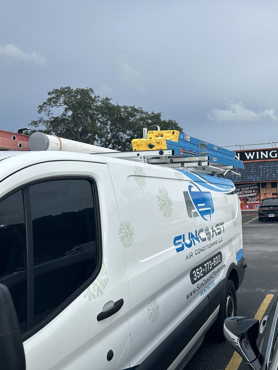 A close view of the SunCoast van outside a shopping plaza in Hudson, FL.