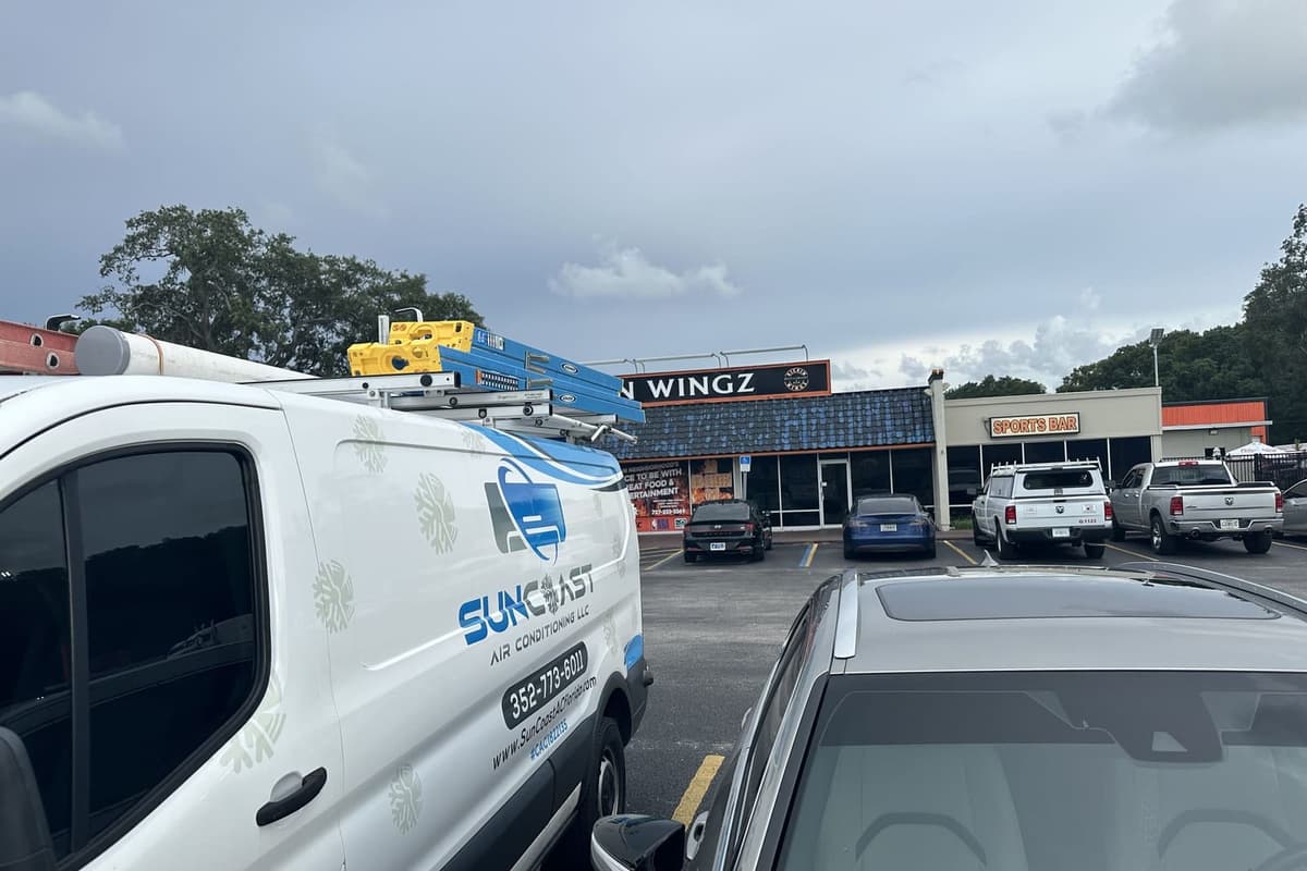 A close view of the SunCoast van outside a shopping plaza in Hudson, FL.
