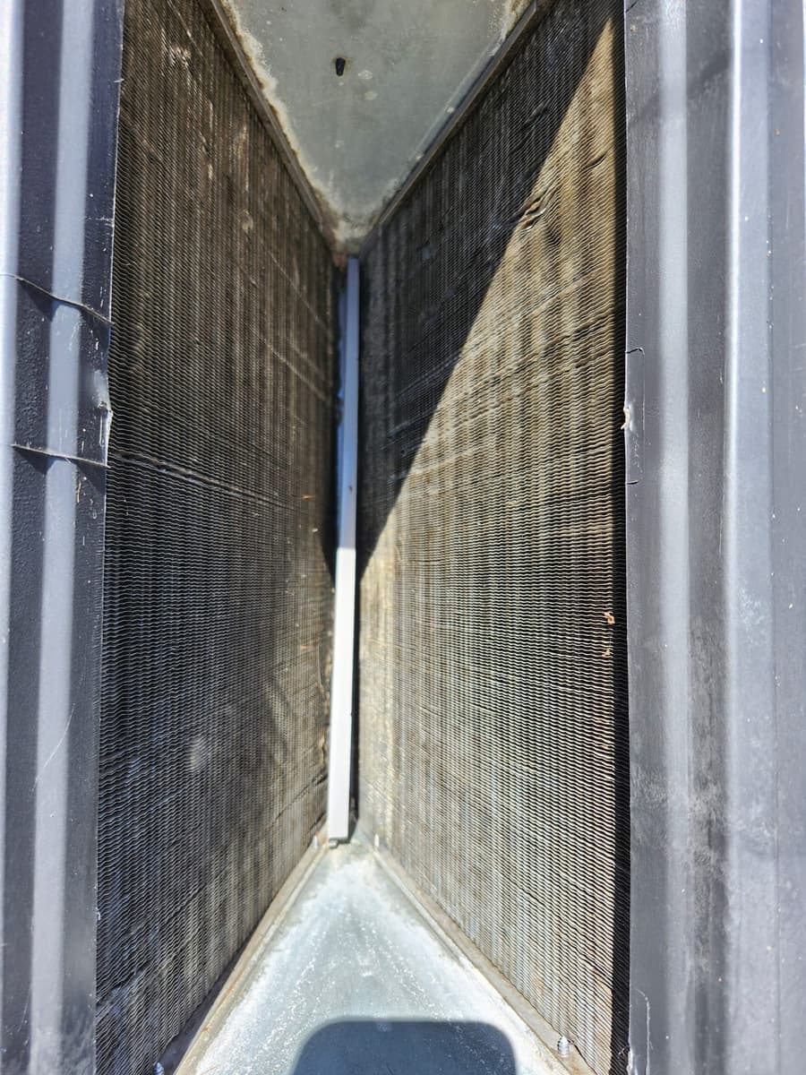 The fins of an outdoor condenser coil up close.