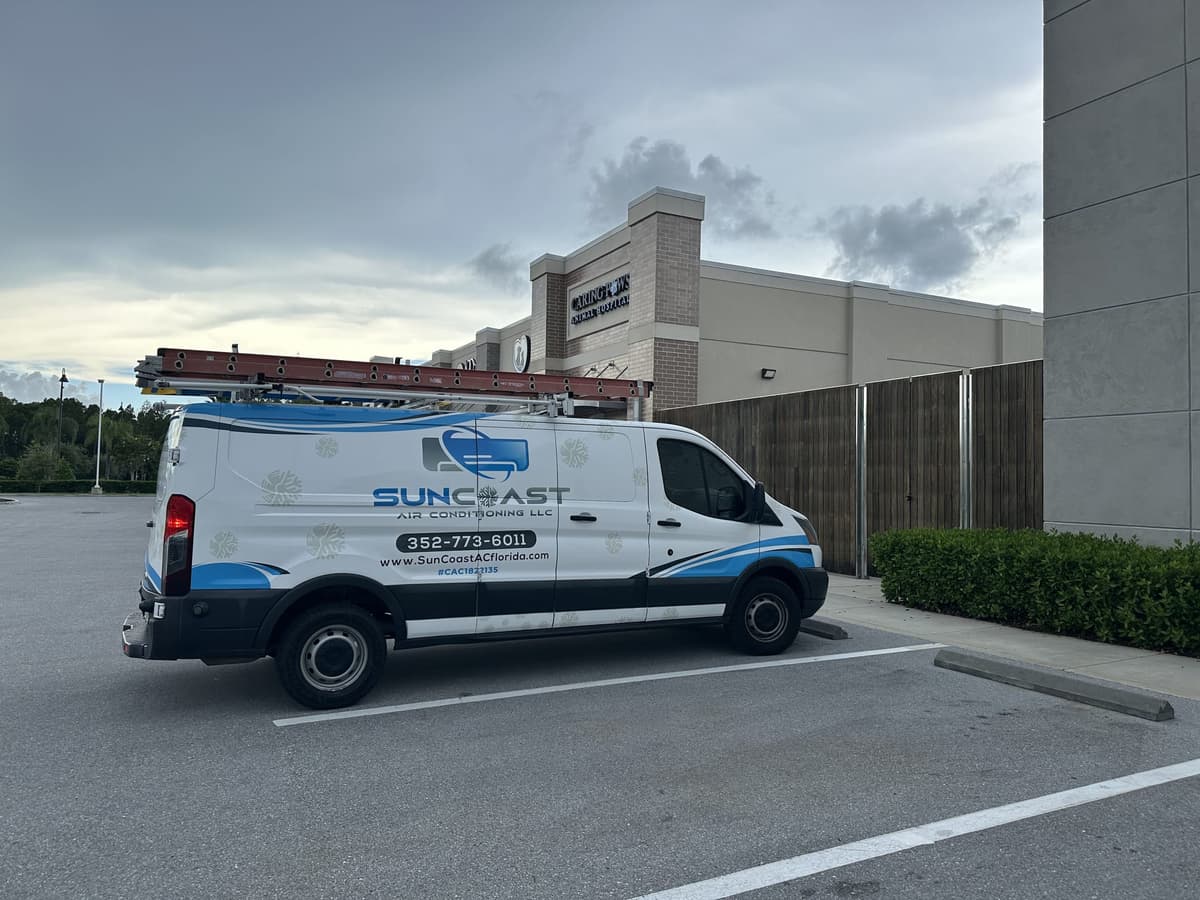 SunCoast Air Conditioning van parked outside a Central Florida shopping plaza