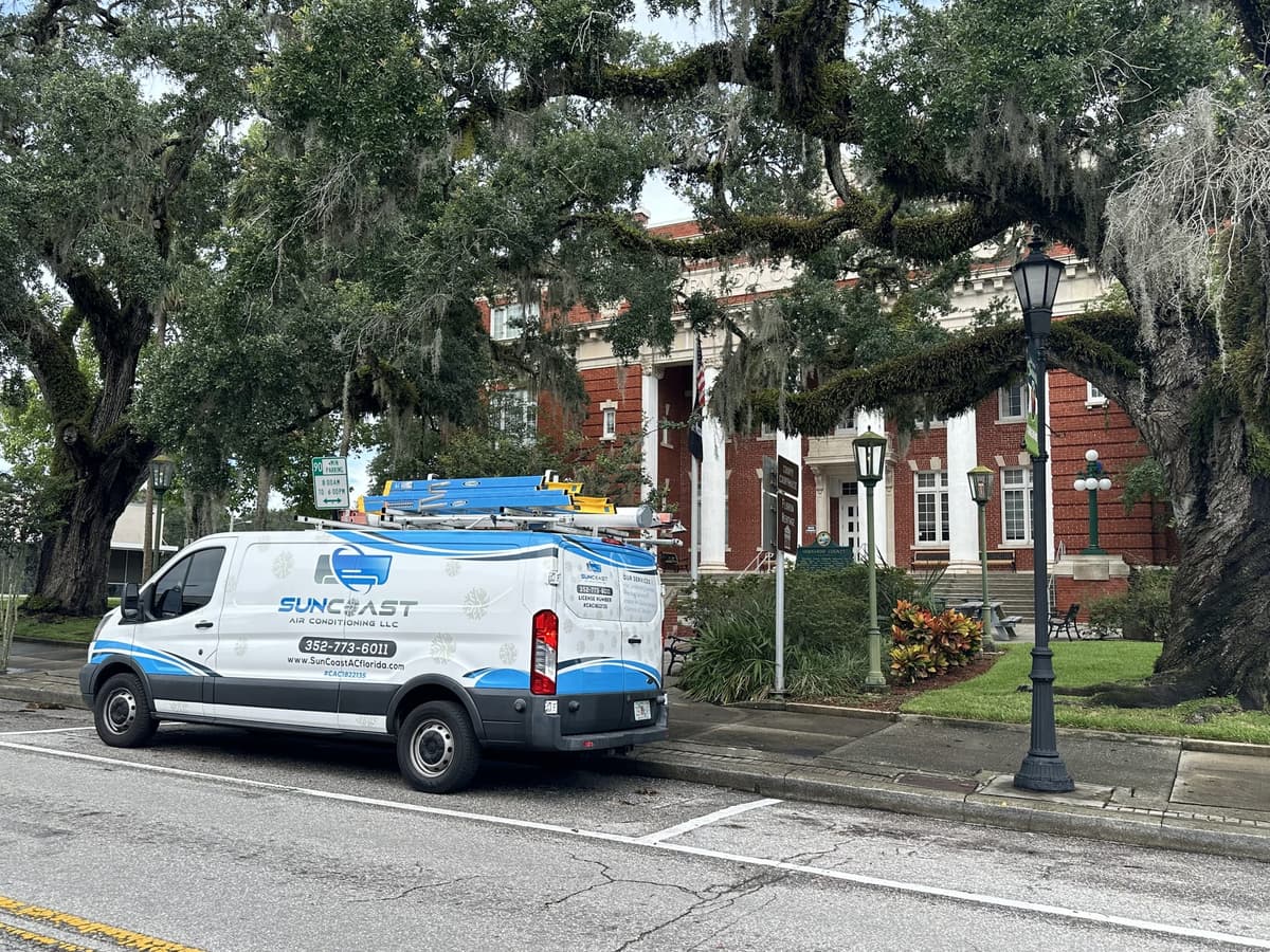 SunCoast Air Conditioning service van parked outside the historic Hernando County Courthouse in Brooksville, Florida