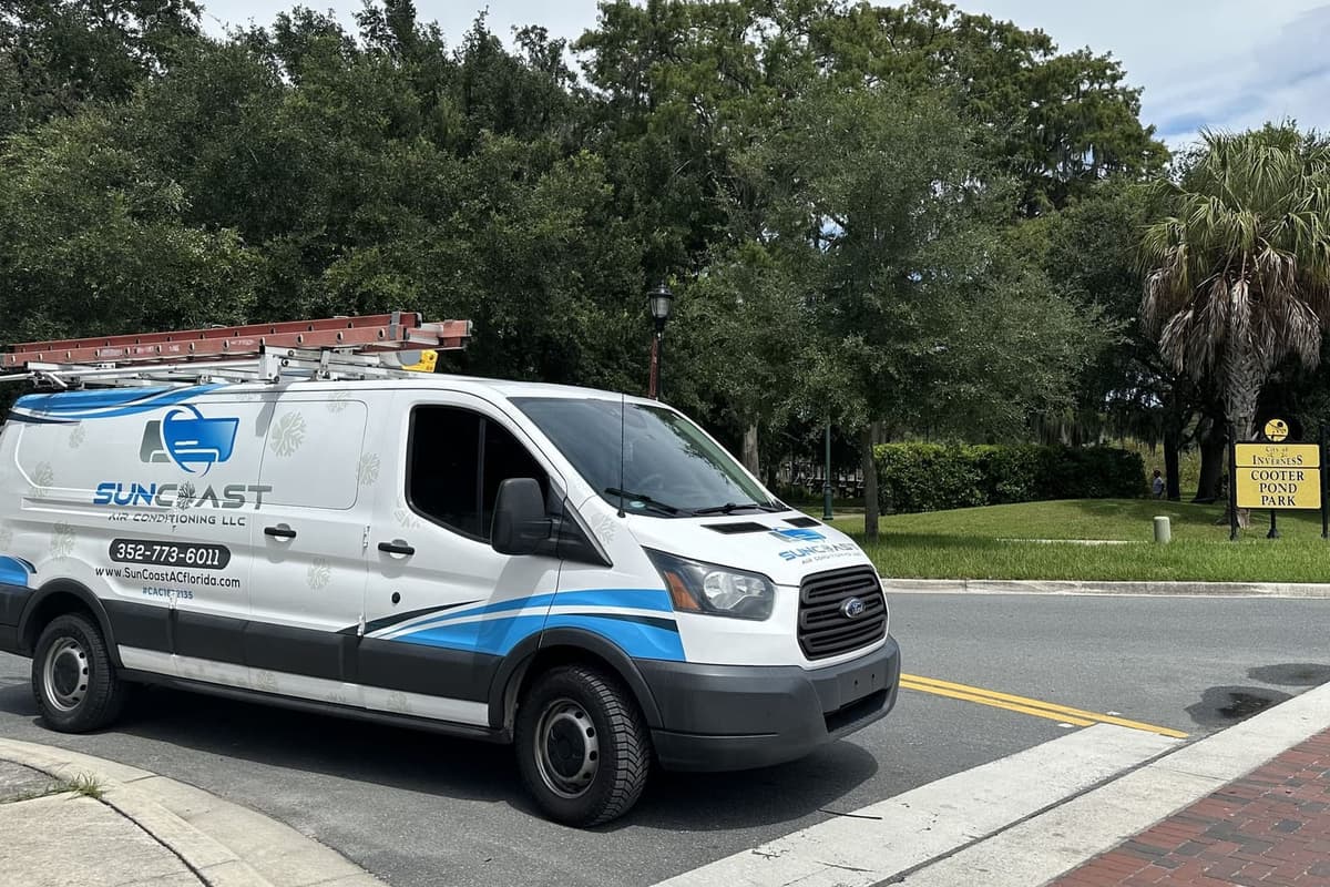 The SunCoast van parked by a brick plaza in Inverness, FL.