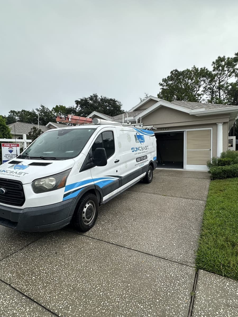 The SunCoast van parked in a driveway outside a garage in Hernando County, FL.