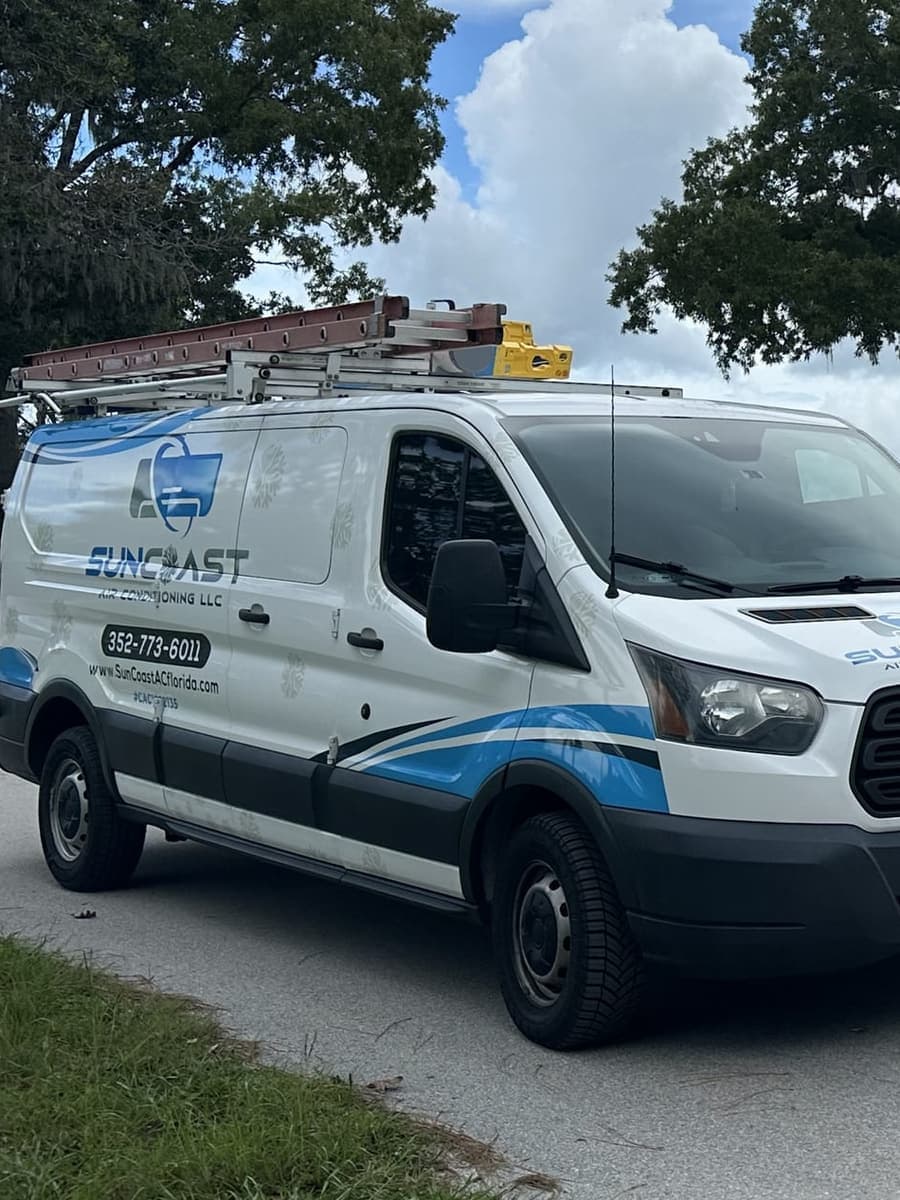 The SunCoast van parked under oak trees in Citrus County, FL.