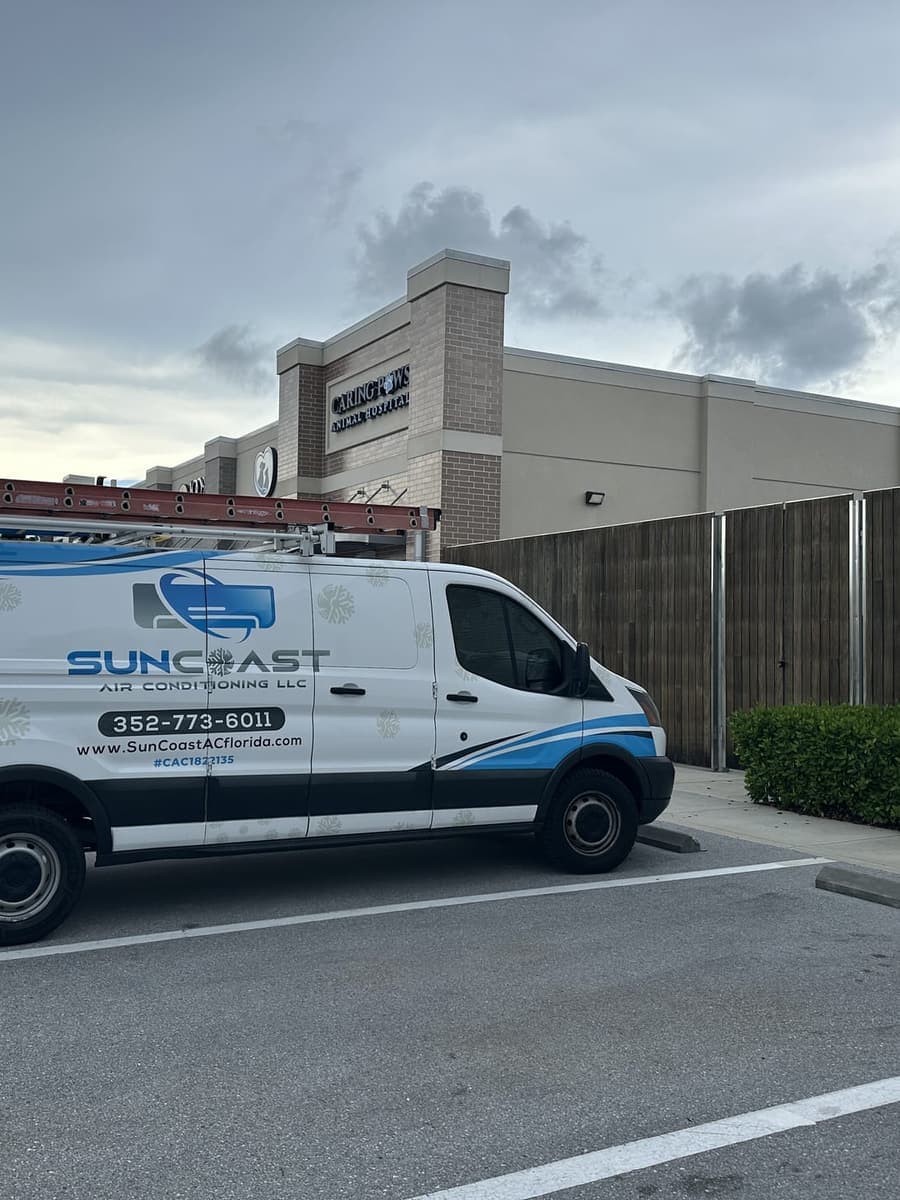 The SunCoast van parked outside a shopping plaza in Odessa, FL.