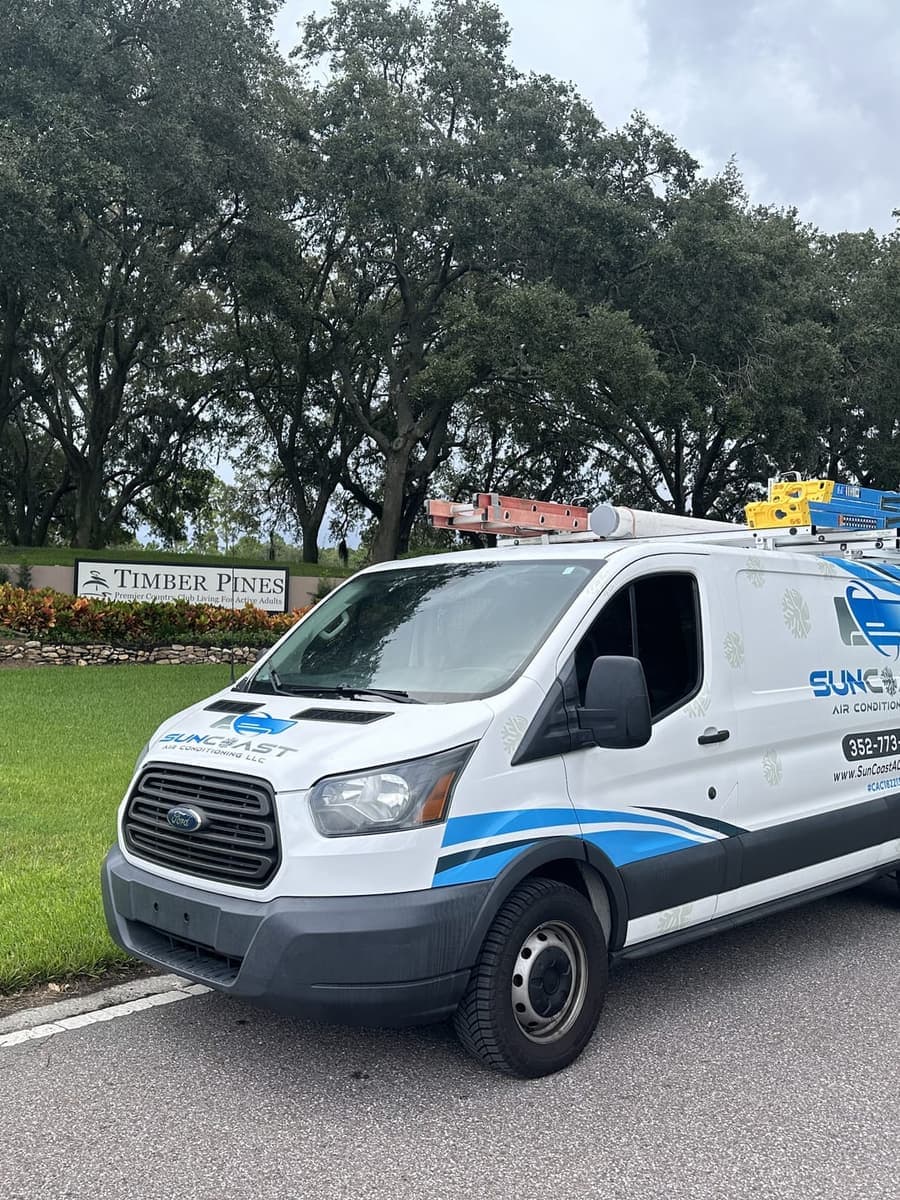 The SunCoast van parked beside a Timber Pines entrance sign in Timber Pines, Spring Hill, FL.