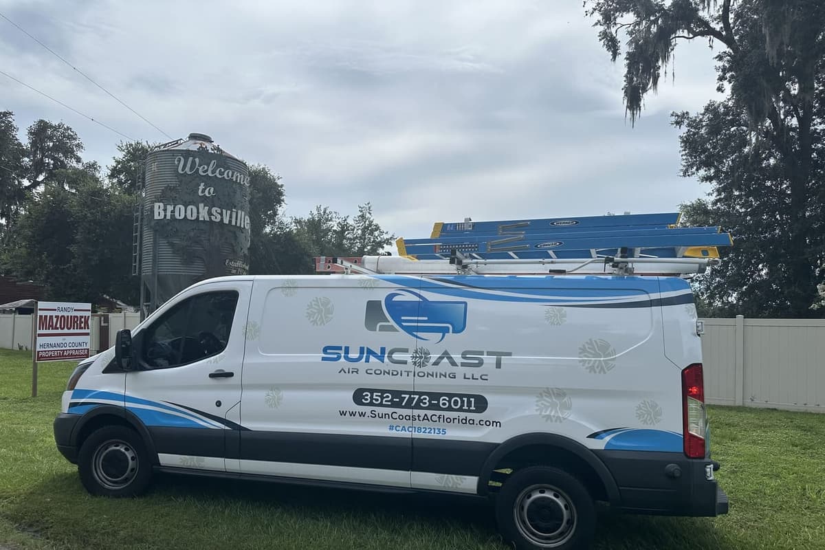 The SunCoast van parked beside a Welcome to Brooksville sign in Brooksville, FL.