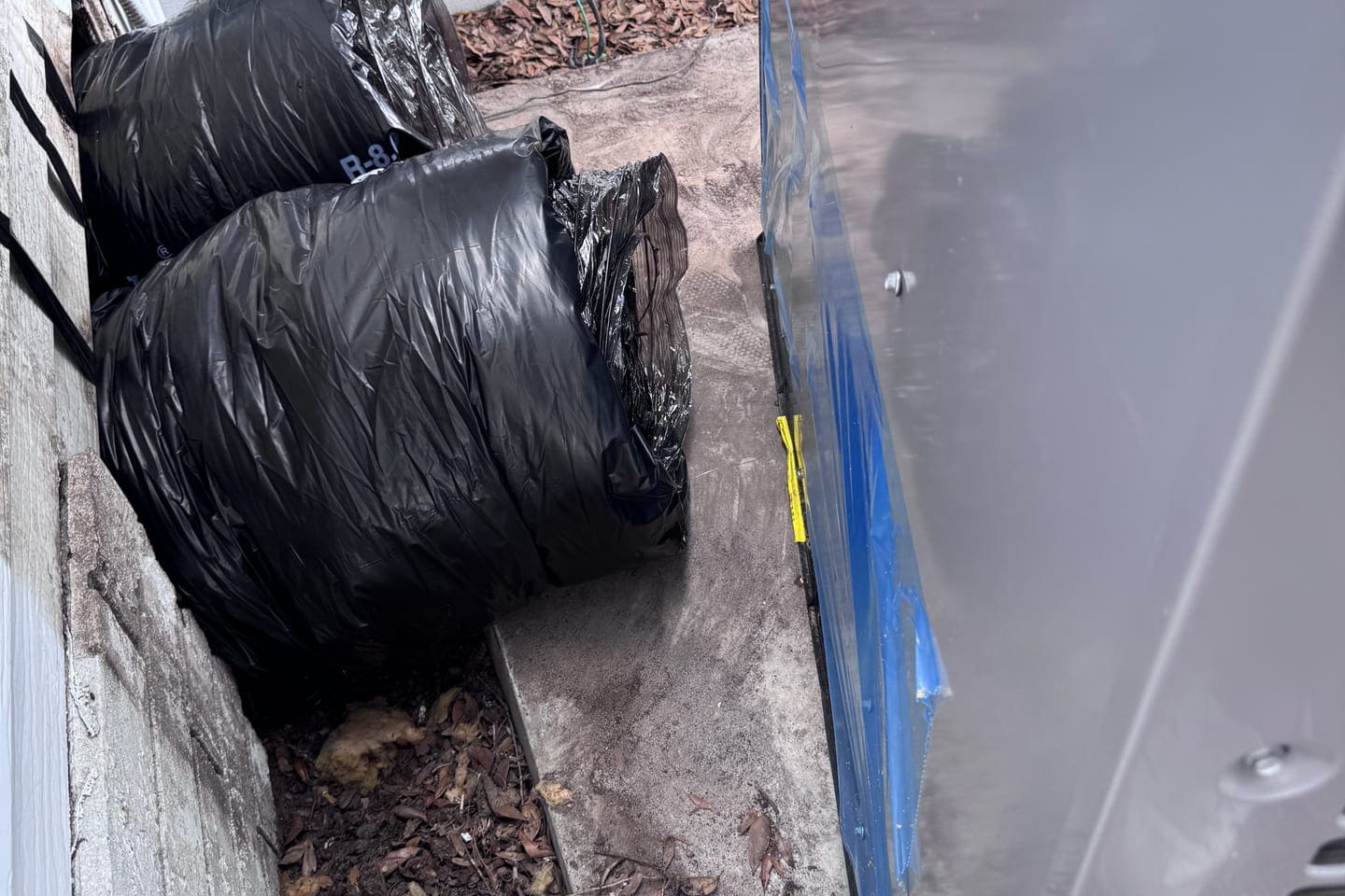 Black-wrapped flexible duct bundled for an installation in Hernando County, FL.