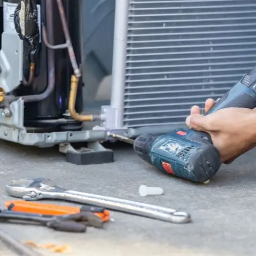 A Man Doing Air Conditioner Installation Services