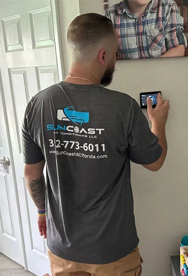 turning the ac system on to check refrigerant levels at the condenser unit during ac service call